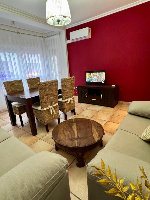 a living room with a table and a dining room at Rosa Somhome in Peniscola