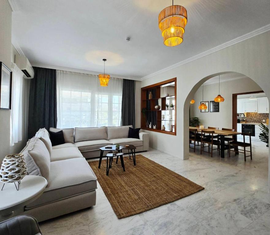 a living room with a couch and a table at Animus House #1 Apartment, Peraia in Perea