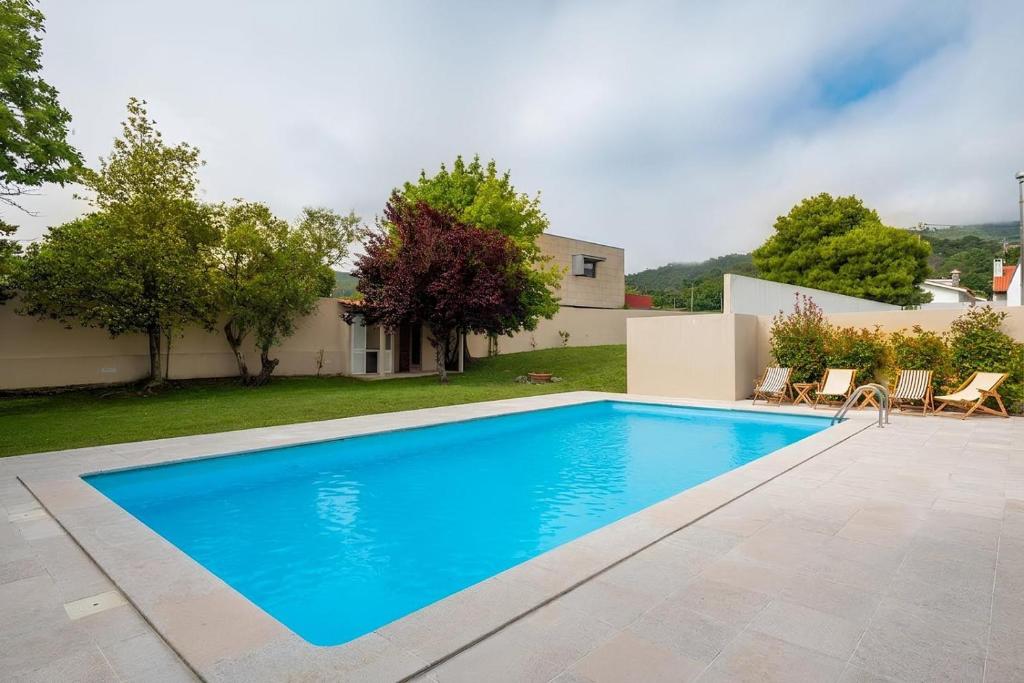 a swimming pool in the backyard of a house at Afife Sea and Mountain Retreat in Afife