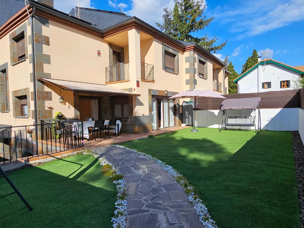 a house with a lawn in front of it at Casa Tejada in San Rafael