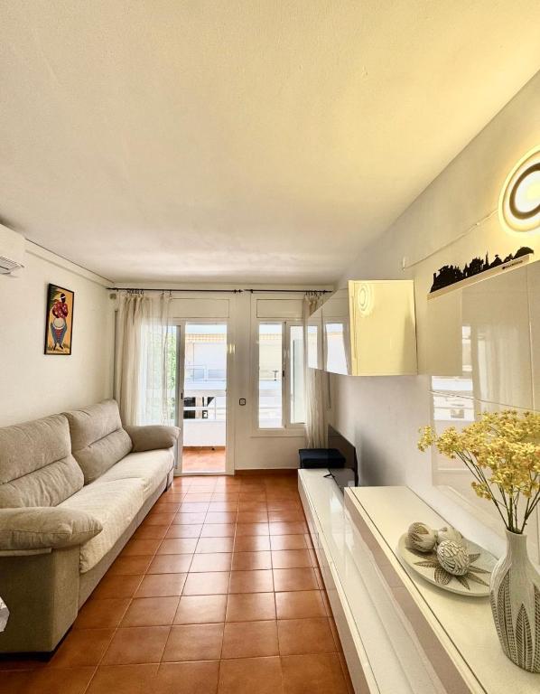 a living room with a couch and a table at Apartamento Tossa in Tossa de Mar