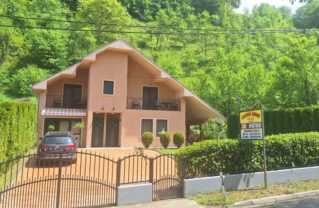 a house with a car parked in front of it at Velez IVANOVI DVORI in Jošanička Banja