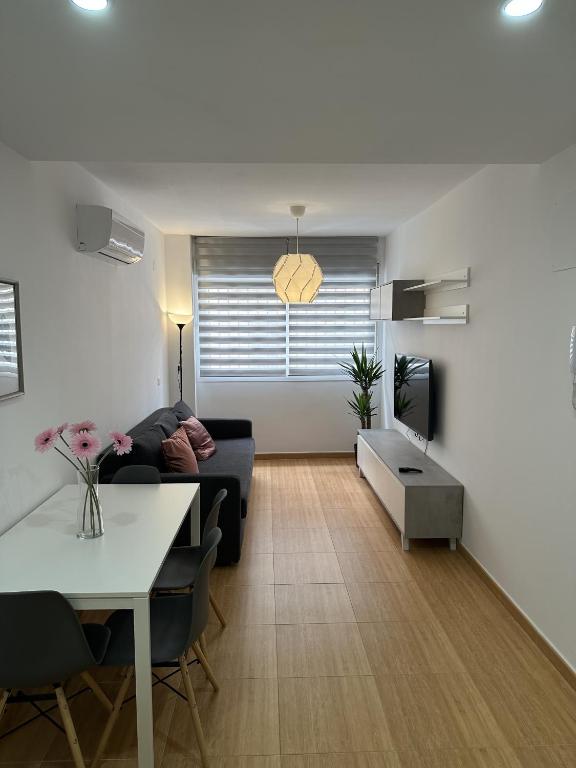 a living room with a couch and a table at APARTAMENTO FELIP 1 in Burriana