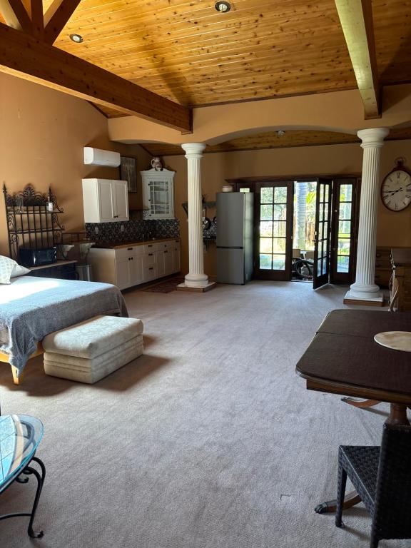 a large room with a bed and a kitchen at Grand Studio with Resort Amenities in Alpine
