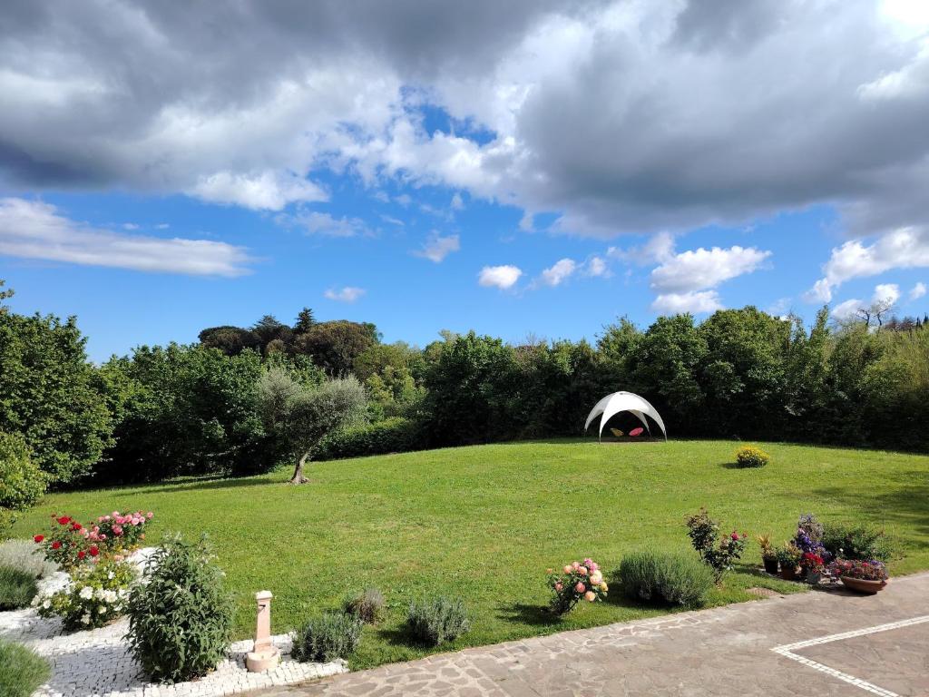 a field with a tent on top of it at Casa Yoga 2 Rilassati in una oasi di pace immersa nella natura a soli 60 minuti da Roma in Bassano Romano