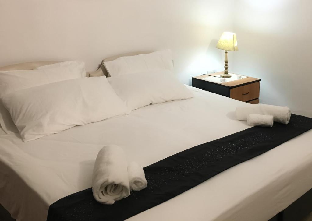 Postel nebo postele na pokoji v ubytování D'Ambrogio Guest House