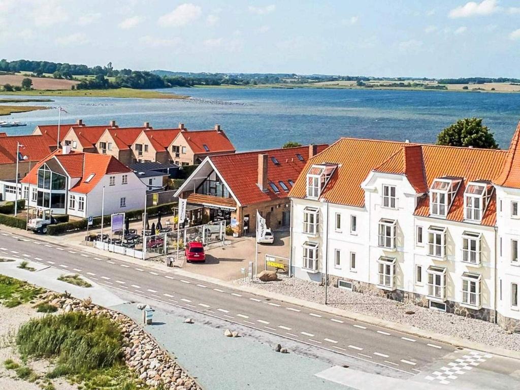 an aerial view of a town with a river and houses at 4 person holiday home in Hejls-By Traum in Hejls