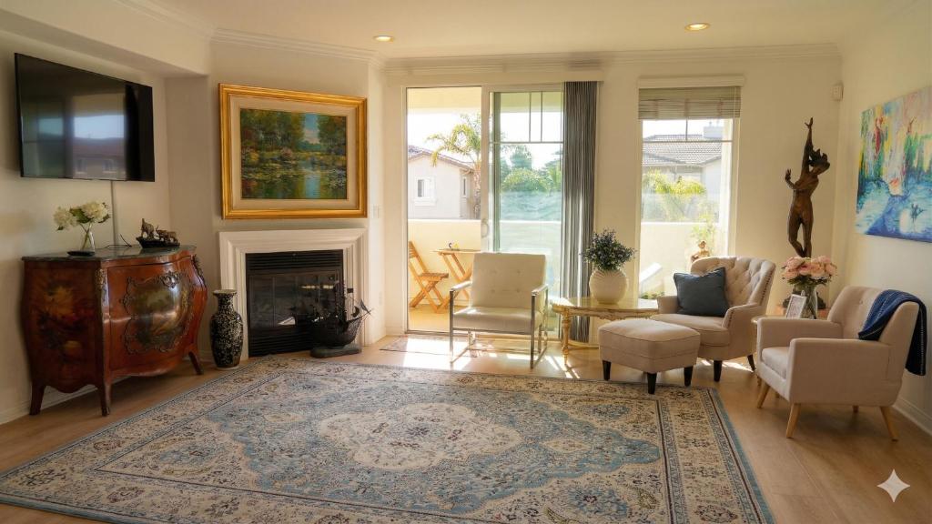 a living room with a couch and a fireplace at Hidden Coastal Gem Between Malibu & SB in Oxnard