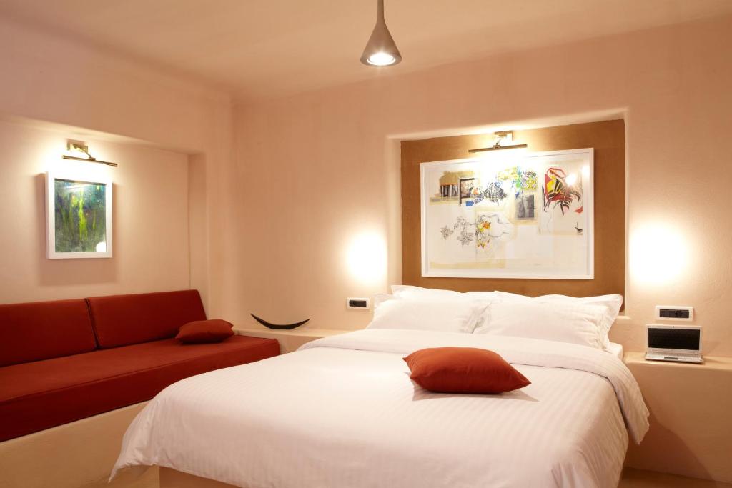 Posteľ alebo postele v izbe v ubytovaní Voreina Gallery Suites
