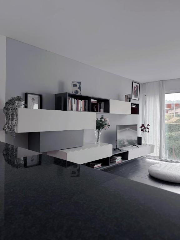 a white living room with a white book shelf at Ailiv Room - Lovely Room in Capriasca in Arni Alp