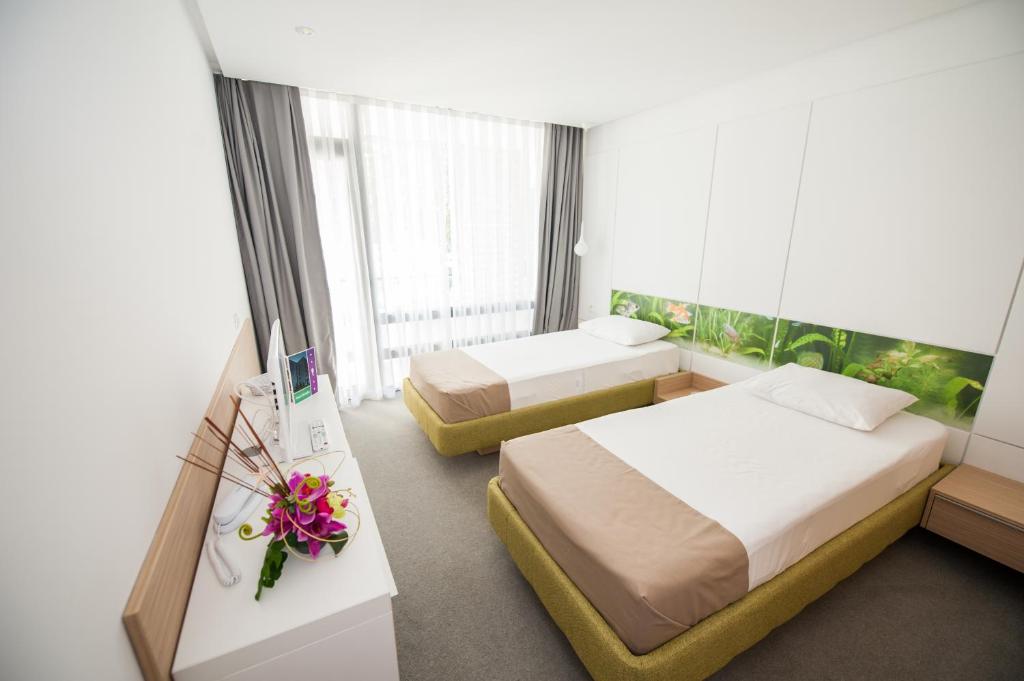 Postel nebo postele na pokoji v ubytování Hotel Melodia