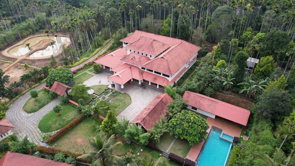 an aerial view of a house with a red roof at Wayanad Mace Mansion in Kenichira
