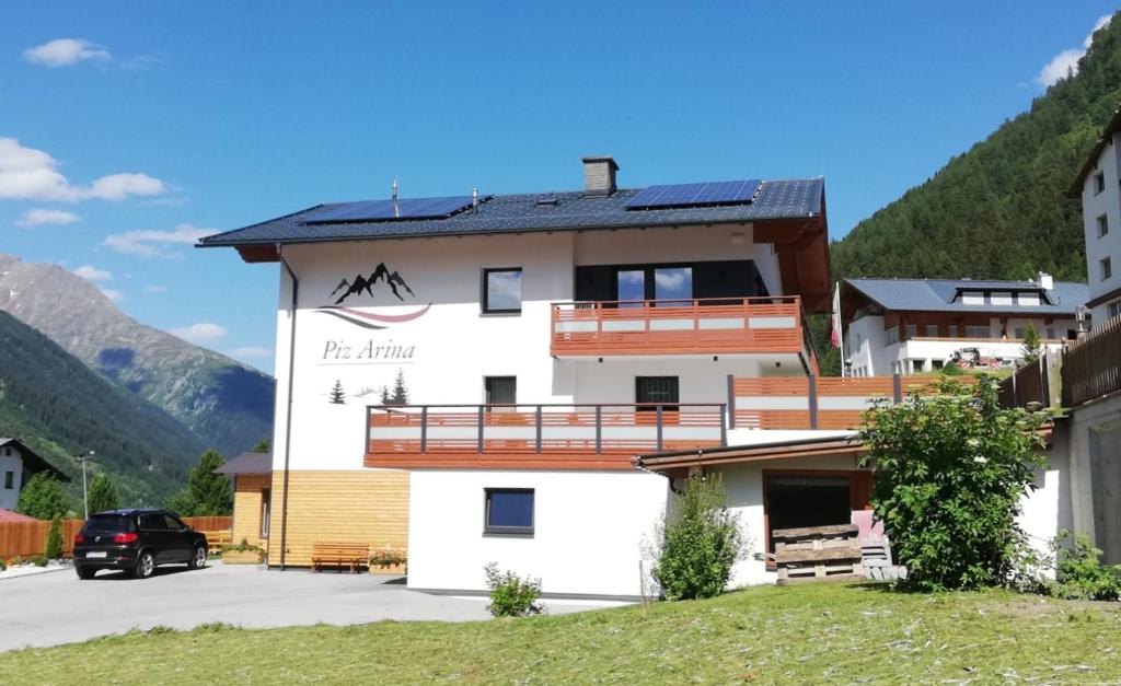 a building with a sign on the side of it at Piz Arina Inklusiv Premium - Card in Galtür