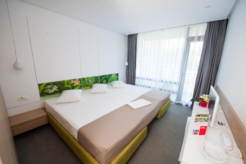 Postel nebo postele na pokoji v ubytování Hotel Melodia