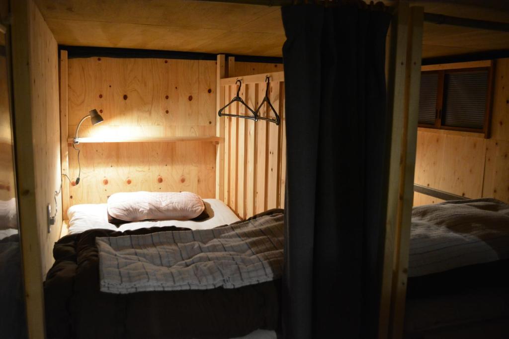 Postel nebo postele na pokoji v ubytování Kagaribi Guesthouse