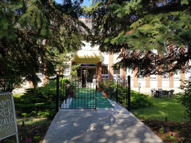 an entrance to a building with a gate in front at Berek Szálló in Balatonfenyves