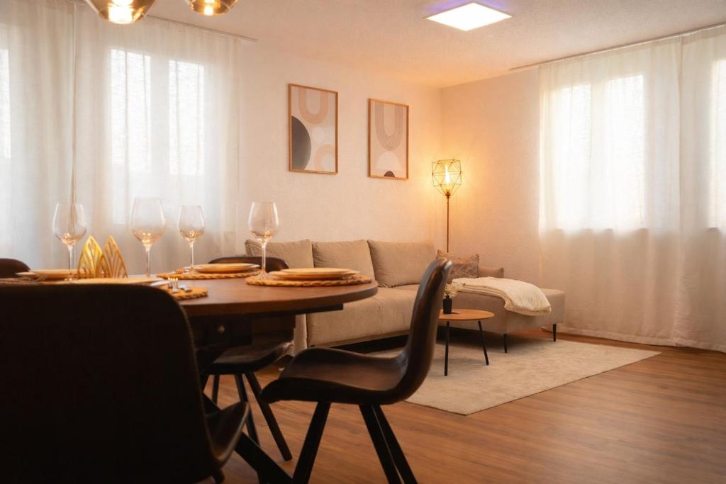 a living room with a table and a couch at Ferienwohnung Südwind 2 in Hohentengen