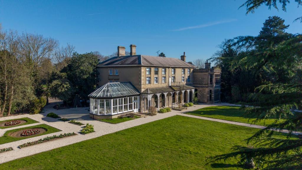 an aerial view of a large house with a garden at Newton Park Country House Hotel in Burton upon Trent