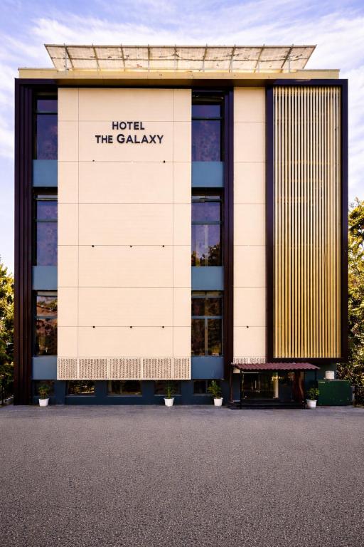 a building with a sign that reads hotel the galaxy at Hotel The Galaxy in Dabok