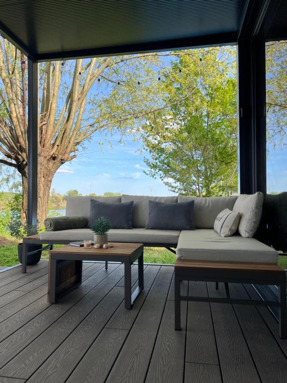 a living room with a couch and a table at Altair House in Mošorin