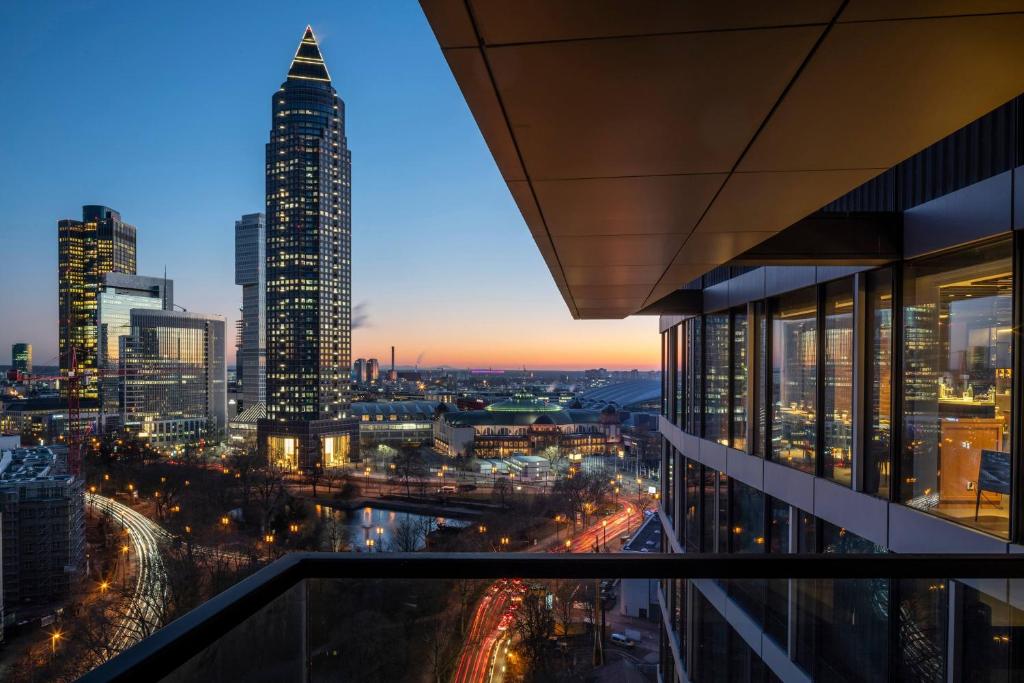 a view of a city skyline at night at Meliá Frankfurt City in Frankfurt
