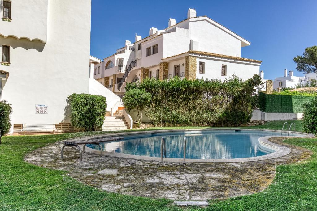 a swimming pool in the yard of a house at Amarres con Piscina in L'Escala