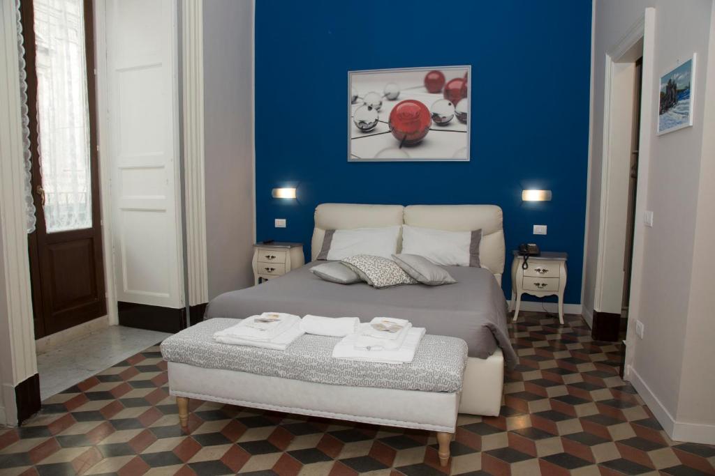 Postel nebo postele na pokoji v ubytování B&B Suite Cutelli