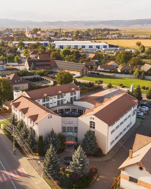 an aerial view of a town with a building at Hotel Atrium in Târgu Secuiesc