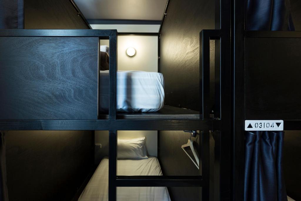 Postel nebo postele na pokoji v ubytování The Pod Sydney