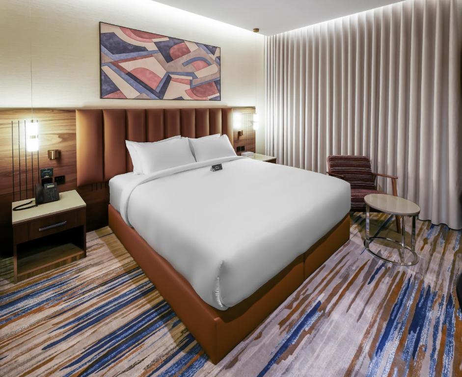 a bedroom with a large bed in a room at فندق لفيف العريض - Lafeef Hotel Al-Aridh in Medina