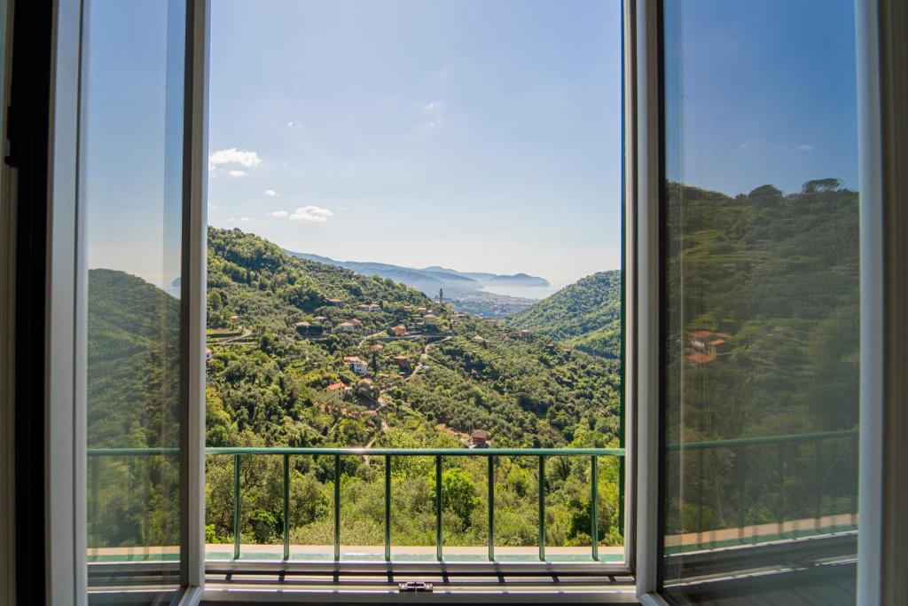 a window with a view of a mountain at Villa Cangallo in Chiavari