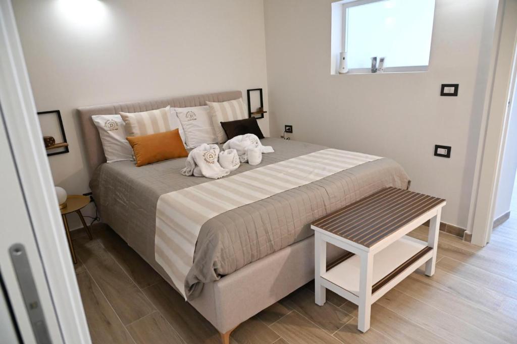 a bedroom with a bed with two stuffed animals on it at DreamHouse in Bari