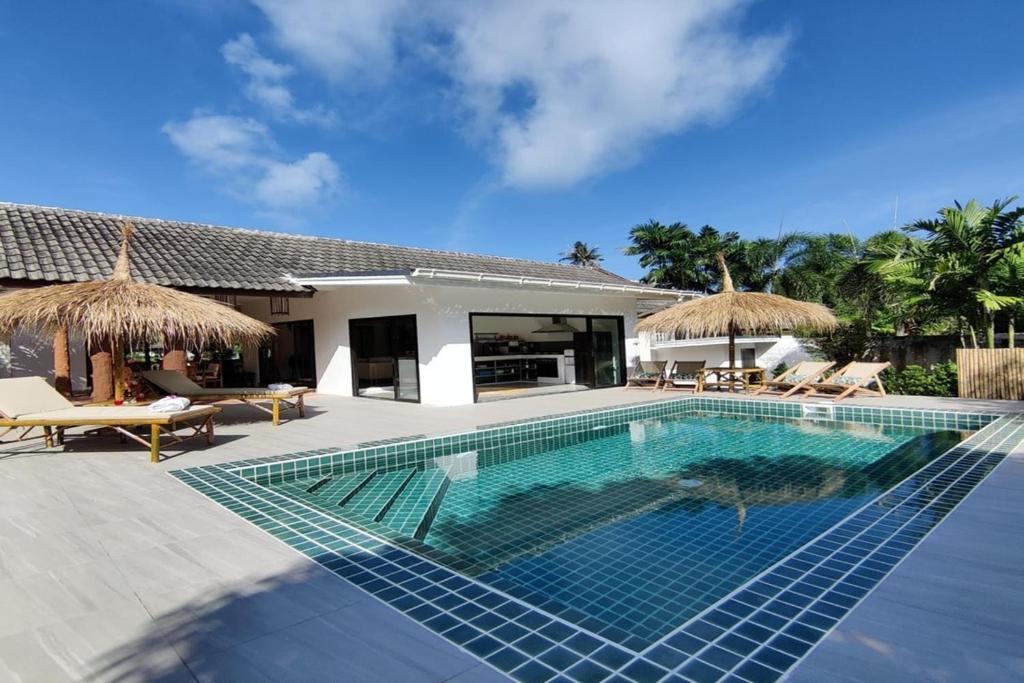 a swimming pool in front of a villa at Southern Lanta B9 in Ko Lanta