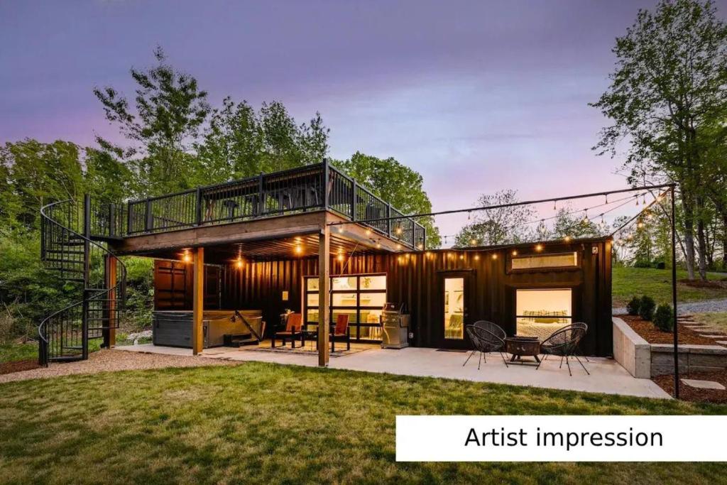 a house with a wrap around porch with a deck at Outdoors Holten - Cabin Skydeck in Holten