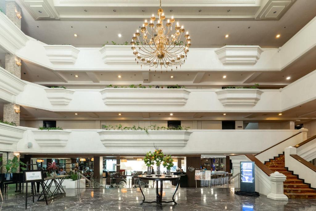a chandelier in the lobby of a hotel at L'Fisher Hotel Bacolod in Bacolod