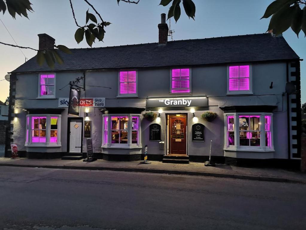 a building with purple lights in front of it at The Granby Rooms Easington East Yorkshire in Easington