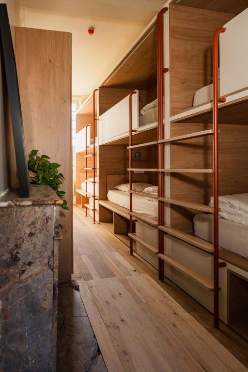 a room with several bunk beds in it at CENTRAL Hostel La Rochelle Centre in La Rochelle