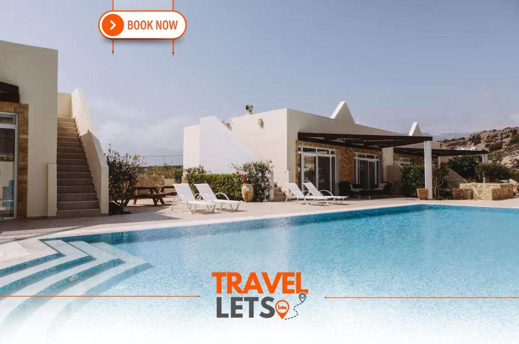 a villa with a swimming pool and a house at Studio Apartment By Travel Lets Holiday Homes Lagada With Pool in Makry Gialos