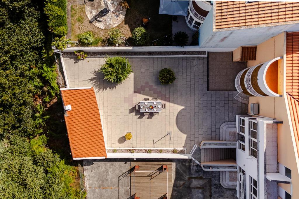 an overhead view of a patio with a table at Caldas Charm Getaway - Garden Terrace & Comfort in Caldas da Rainha