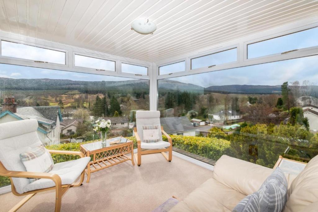 a large living room with a large glass window at 2 Bed in Killin oc-pe512 in Killin