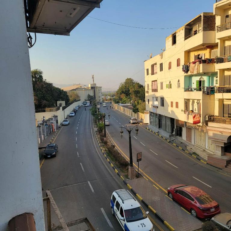 a view of a street with cars and buildings at OS & MA Luxor in Luxor