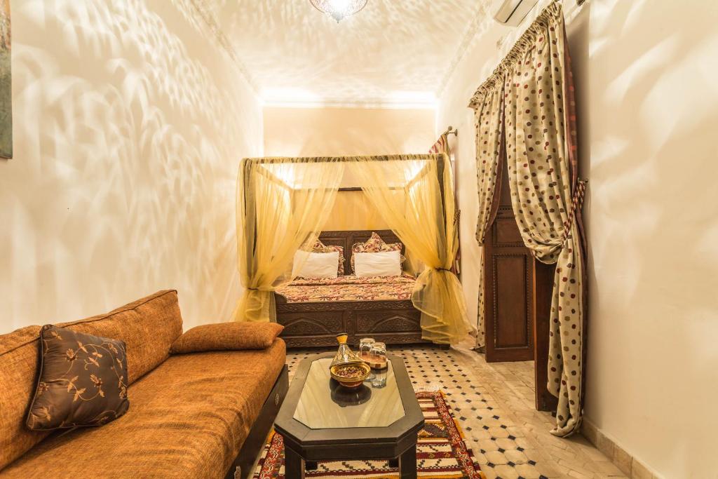 Postel nebo postele na pokoji v ubytování Riad Nasreen