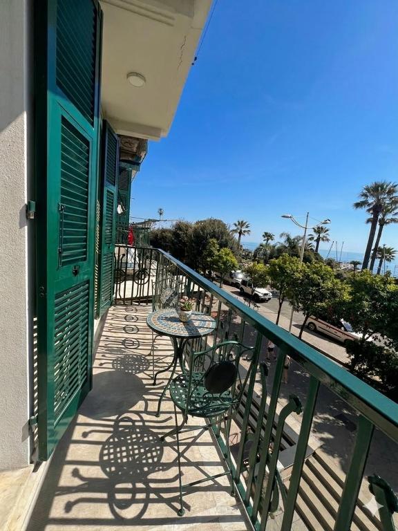 a balcony with tables and chairs on a building at Appartamento 37 Varazze in Varazze