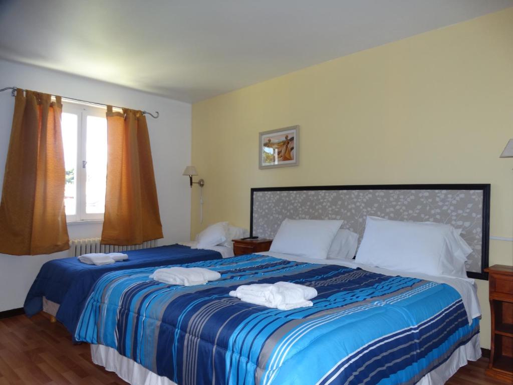 Postel nebo postele na pokoji v ubytování Hosteria La Pastorella