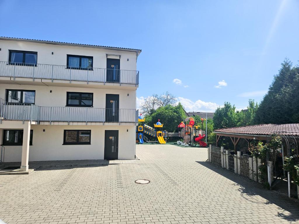 a large white building with a balcony on the side of it at Black Forest Hotel Kappel-Grafenhausen in Kappel-Grafenhausen