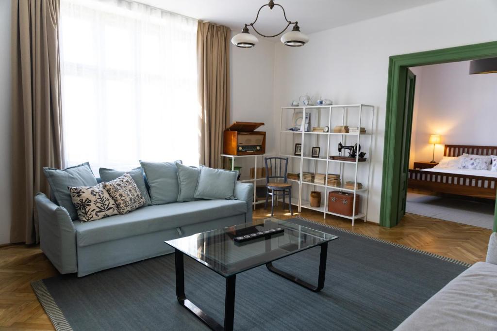 a living room with a couch and a coffee table at Nostalgia in Turda