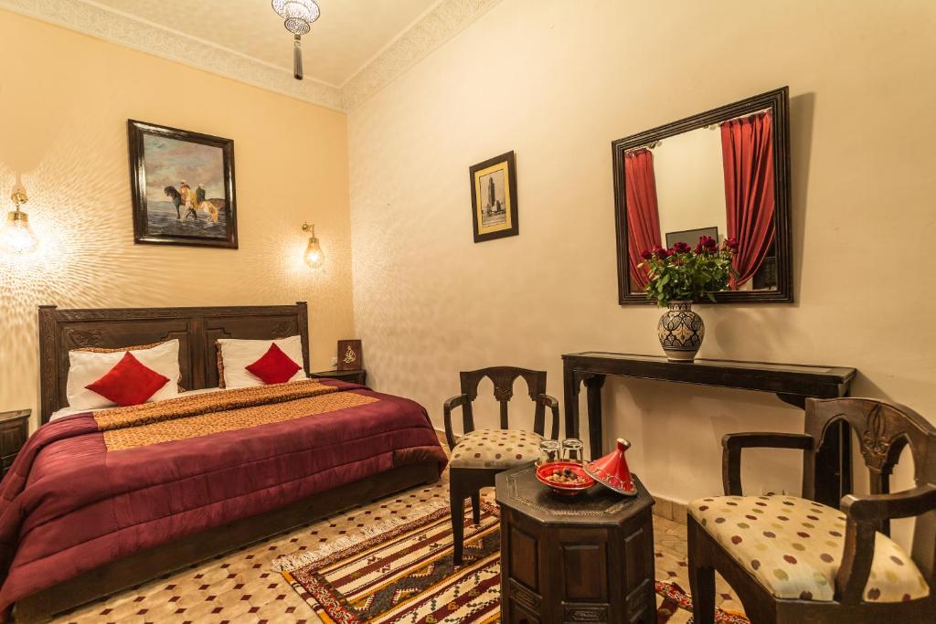 Postel nebo postele na pokoji v ubytování Riad Nasreen