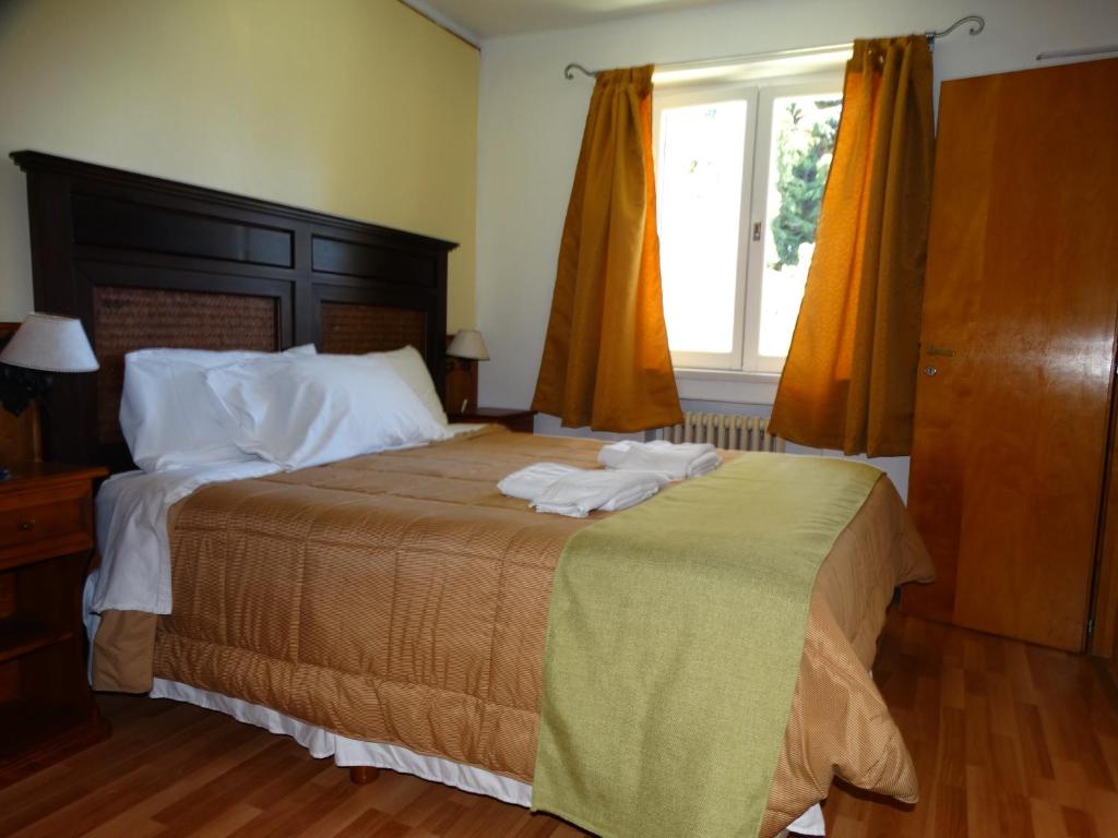 Postel nebo postele na pokoji v ubytování Hosteria La Pastorella
