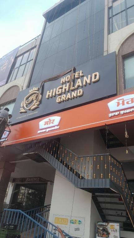 a no left island grand sign on a building at Hotel highland grand in Zirakpur