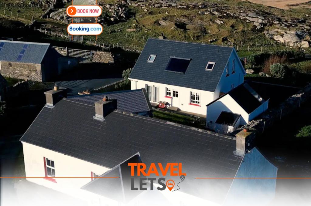 an overhead view of a house with a roof at 2 Bedroom Cottage By Travel Lets Self Catering Accommodation Donegal With Sea View in Fanad